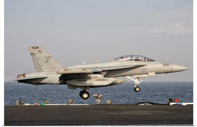 An EA-18G taking off from the flight deck of USS George H.W. Bush