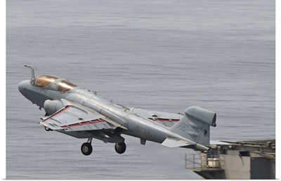 An EA-6B Prowler lifts off from the flight deck of USS Harry S. Truman