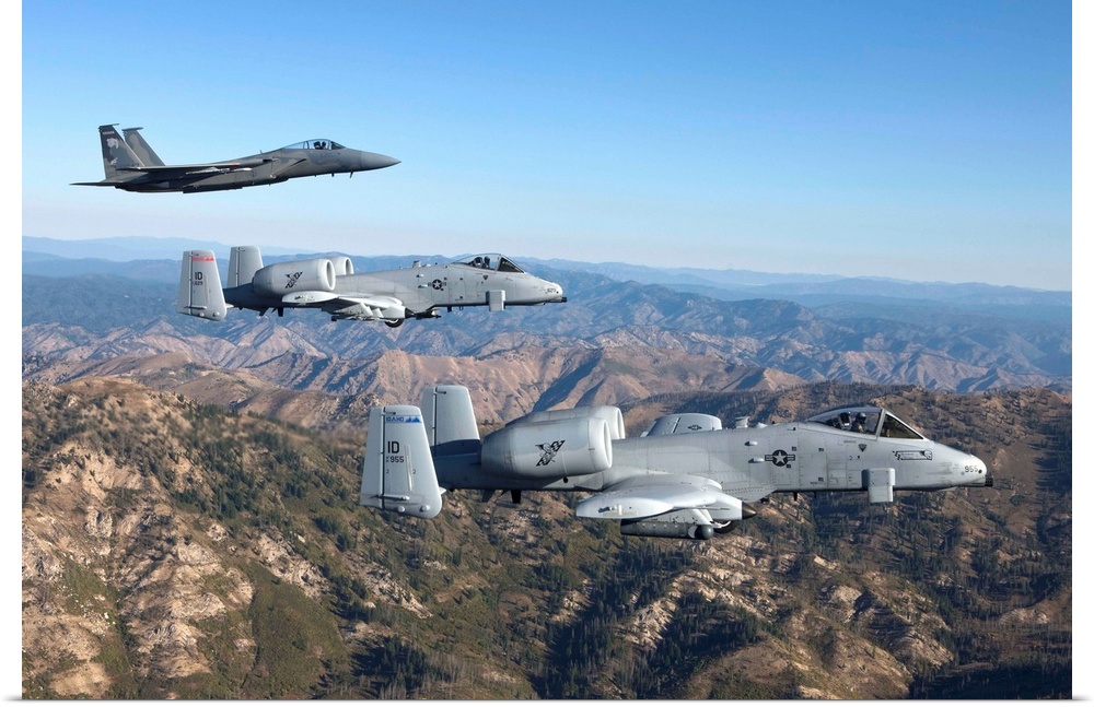 An F-15 Eagle from the 173rd Fighter Wing flies in formation with two A-10 Thunderbolt's from the 124th Fighter Wing over ...