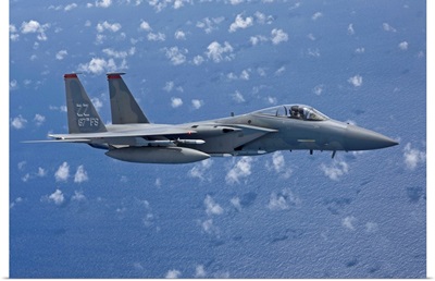 An F-15 Eagle flies over the Pacific Ocean during a training mission