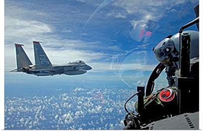 An F-15 Eagle pilot flies in formation with his wingman