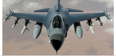 An F-16 Fighting Falcon flies a mission in the skies near Iraq