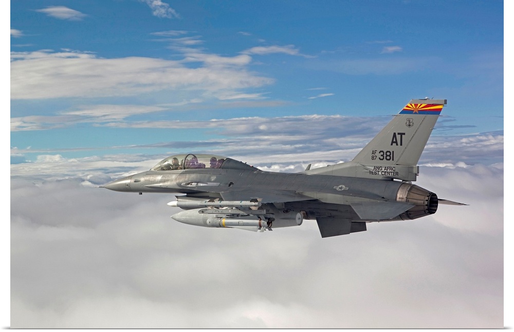 An F-16 Fighting Falcon from the Air National Guard Air Force Reserve Test Center flies with an AGM-65 Maverick missile du...