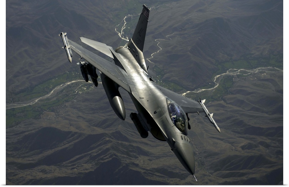 July 22, 2014 - An F-16C Fighting Falcon flies over Afghanistan after an in-air refueling mission in support of Operation ...