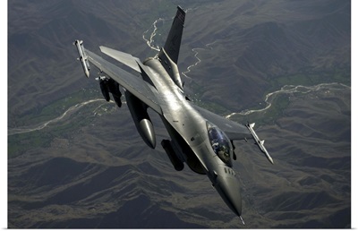 An F-16C Fighting Falcon flies over Afghanistan