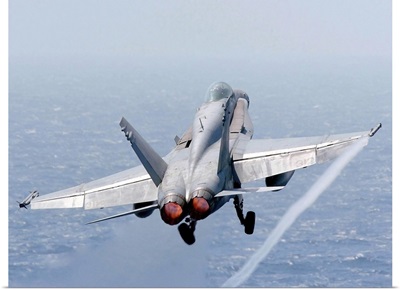 An F/A-18 Hornet taking off