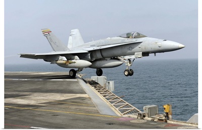 An F/A 18C Hornet launches from the aircraft carrier USS Harry S. Truman