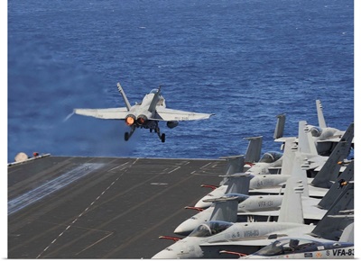 An F/A-18C Hornet launches off the flight deck of USS Dwight D. Eisenhower