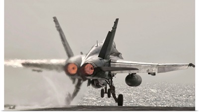 An F/A-18C Hornet takes off from USS George H.W. Bush