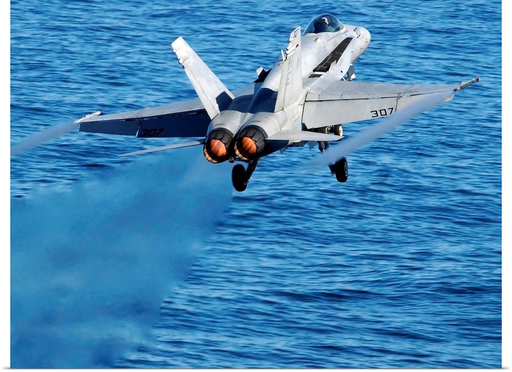 An F/A-18C Hornet taking off.