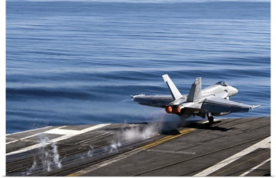 An F/A 18E Super Hornet launches from the flight deck of USS Carl Vinson