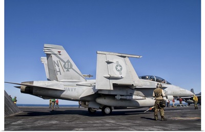 An F/A-18F Super Hornet moves into launch position aboard aircraft carrier USS Nimitz