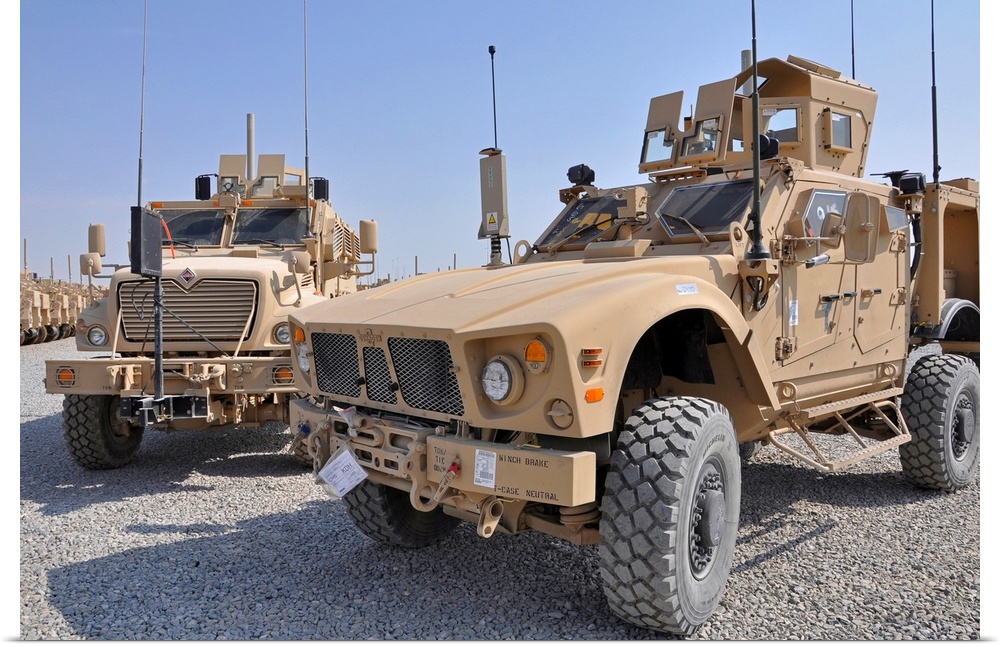 October 22, 2009 - A Mine Resistant Ambush Protected all-terrain vehicle (M-ATV), right, is parked next to a MaxxPro MRAP ...