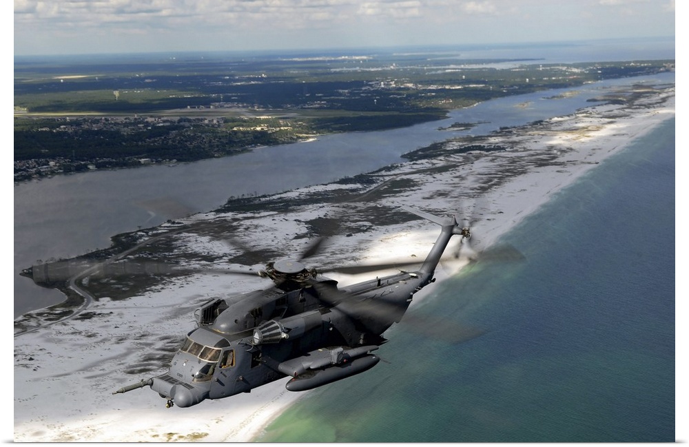 An MH-53 Pave Low flies over the coastline of Florida.