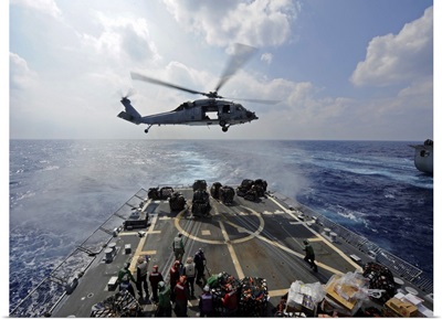 An MH-60R Sea Hawk Transfers Supplies To The Flight Deck Of USS Wayne E Meyer
