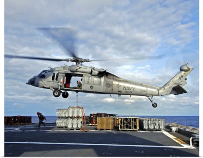 An MH-60S Seahawk prepares to deliver ammunition