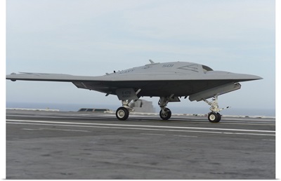 An X-47B Unmanned Combat Air System Conducts A Touch And Go Landing
