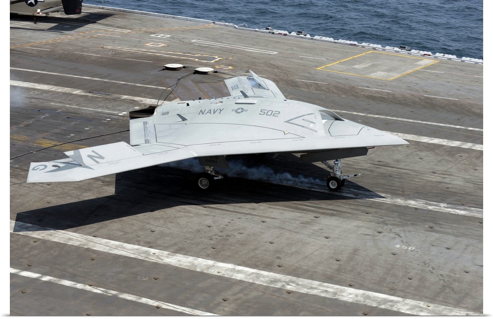 Atlantic Ocean, July 10, 2013 - An X-47B Unmanned Combat Air System (UCAS) makes a carrier-based arrested landing aboard t...
