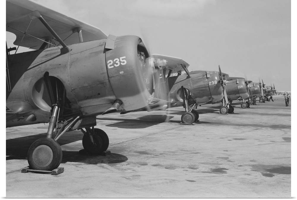 August 1942 - Naval air base, Corpus Christi, Texas. Lined up and looking eager for flight are Navy fighter planes at the ...