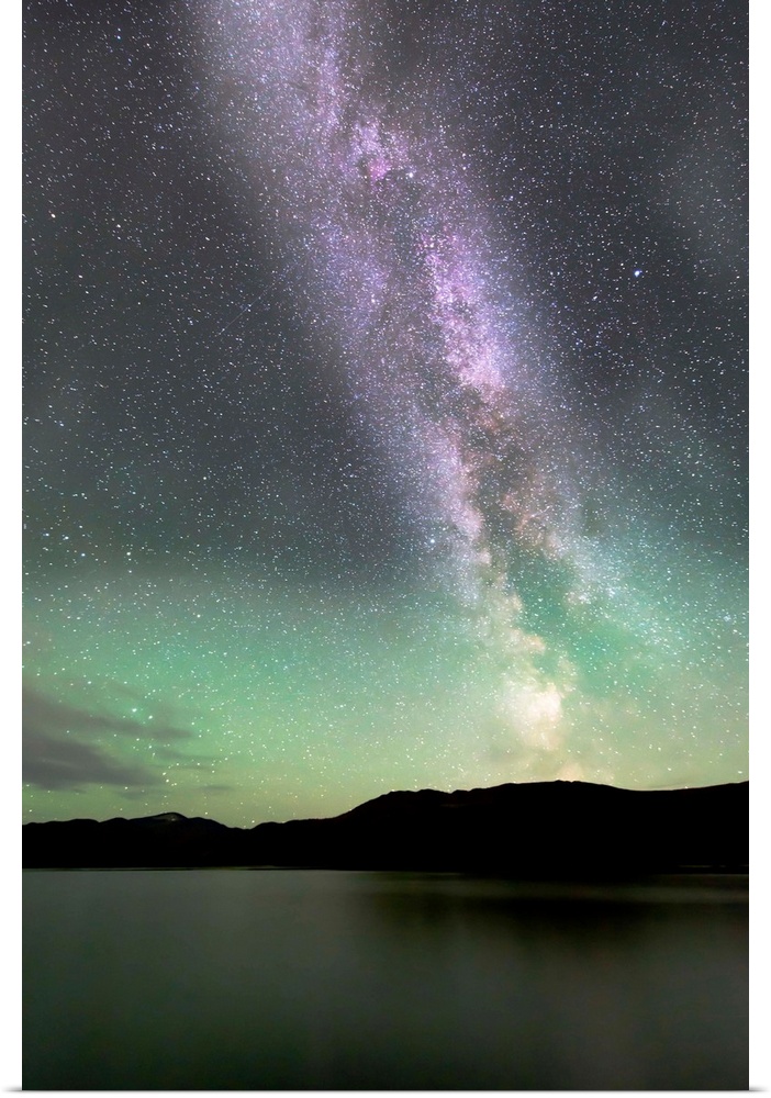 Aurora borealis and Milky Way above Fish Lake, Whitehorse, Yukon, Canada.