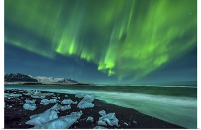 Aurora borealis over the ice beach near Jokulsarlon, Iceland