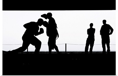 Aviation Boatswain's Mates Practice Boxing In The Hangar Bay
