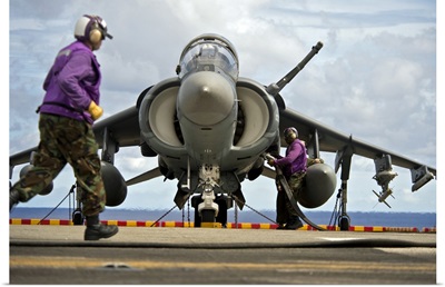 Aviation Boatswain's Mates Refuel An AV-8B Harrier Jet Aircraft