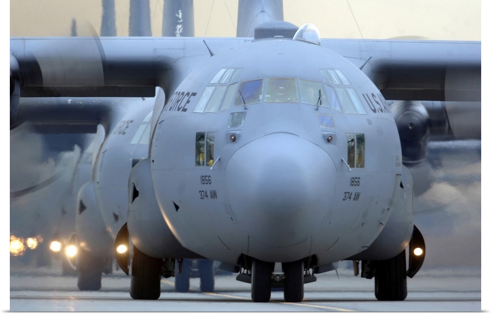 Yokota Air Base, Japan - C-130 Hercules aircraft taxi out for a mission during a six-ship sortie.