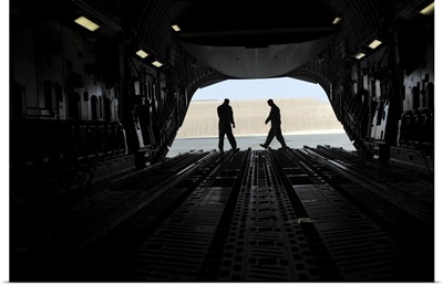 C-17A Globemaster III Loadmasters Go Through Prefight Checks On The Ramp
