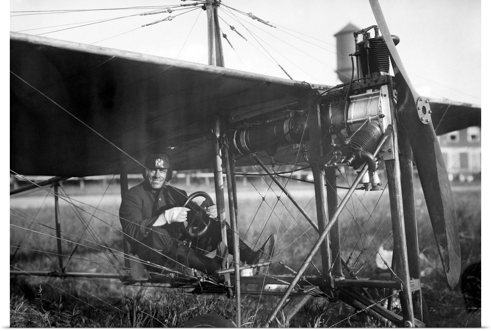 Charles Murphy, aka Mile-a-Minute Murphy, seated in a monoplane. Murphy was a policeman who championed the use of airplane...