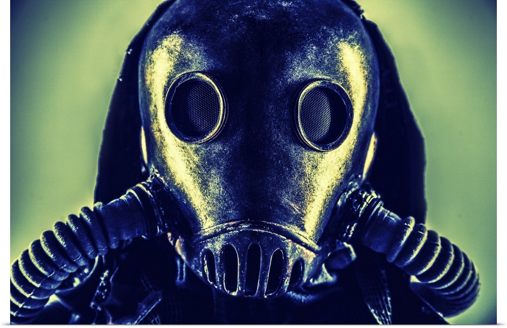 Close-up portrait of post-apocalypse survivor wearing rags and full-face gas mask.