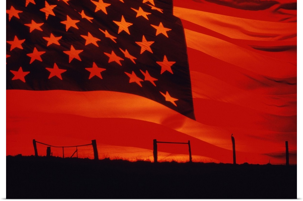 Digital composite of the American Flag over the countryside.