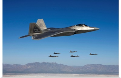 F-22 Raptors fly in formation during a training mission over New Mexico