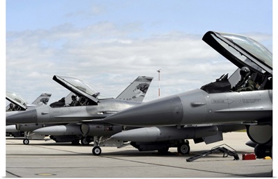 F16 Fighting Falcons await to launch for a training mission
