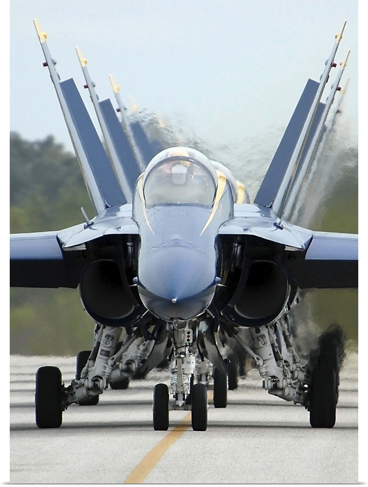 F/A-18A Hornets assigned to the Blue Angels, taxi back to their flight line.