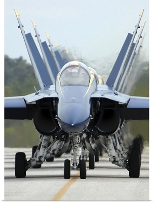 F/A-18A Hornets assigned to the Blue Angels, taxi back to their flight line
