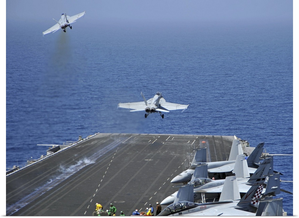 Red Sea, March 17, 2011 - F/A-18F Super Hornets launch from the aircraft carrier USS Enterprise (CVN-65). Enterprise is on...