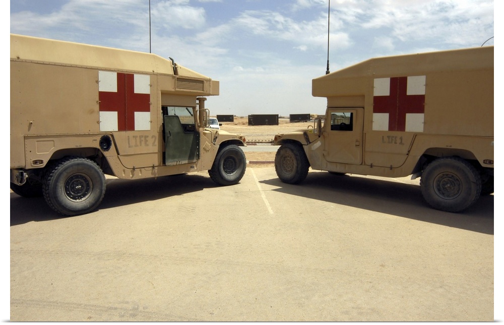 Al Asad, Iraq -LIFE 1 and LIFE 2 field ambulances sit ready if the call comes to deliver injured persons to departing airc...