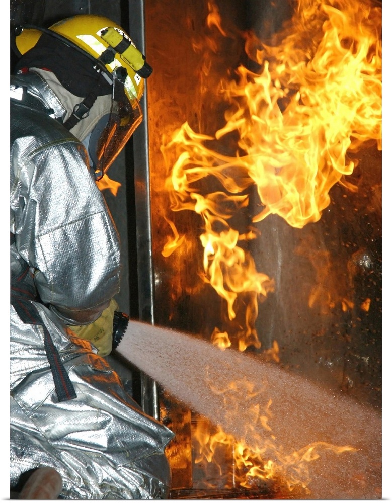 Davis-Monthan Air Force base, Arizona, August 31, 2004 - Firefighter extinguishes a simulated structural fire.