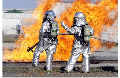 Firefighters Battle A Simulated Fire