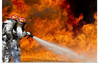Firefighters combat a JP-8 jet fuel fire