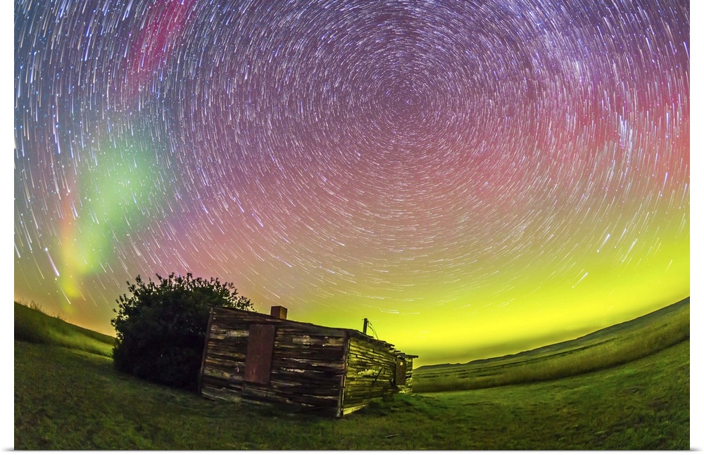 August 27-28, 2014 - Fish-eye lens composite of aurora borealis and circumpolar star trails above the old Larson Ranch sit...
