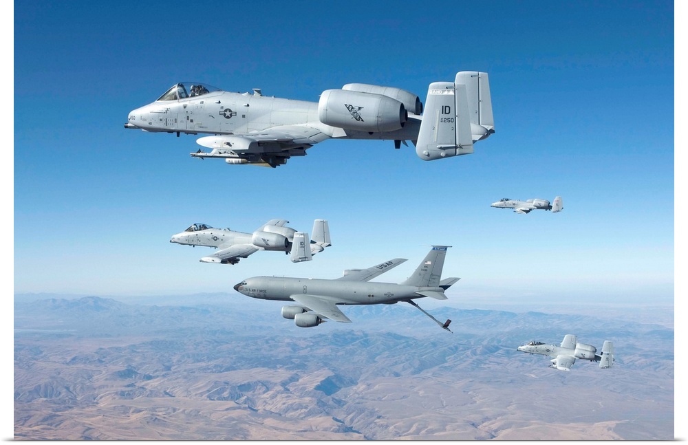 Four A-10C Thunderbolt's from the 190th Fighter Squadron prepare to recieve fuel from a KC-135 aerial refueling tanker ove...