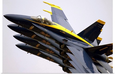 Four Blue Angels F/A18C Hornets perform the Echelon Parade maneuver
