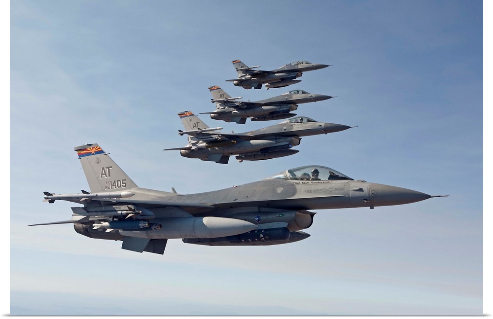 Four F-16's from the Air National Guard Air Force Reserve Test Center fly in formation during a test mission out of the Tu...