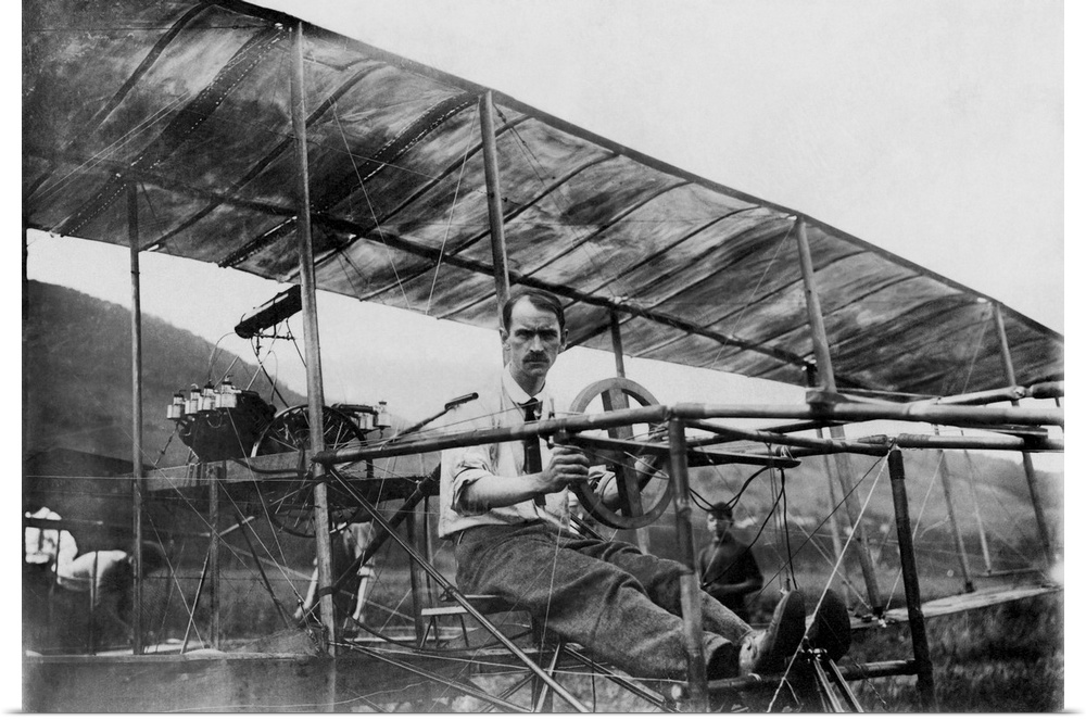 American history photo of Glenn Curtiss, the founder of the aircraft industry in the United States, in his biplane. He sta...