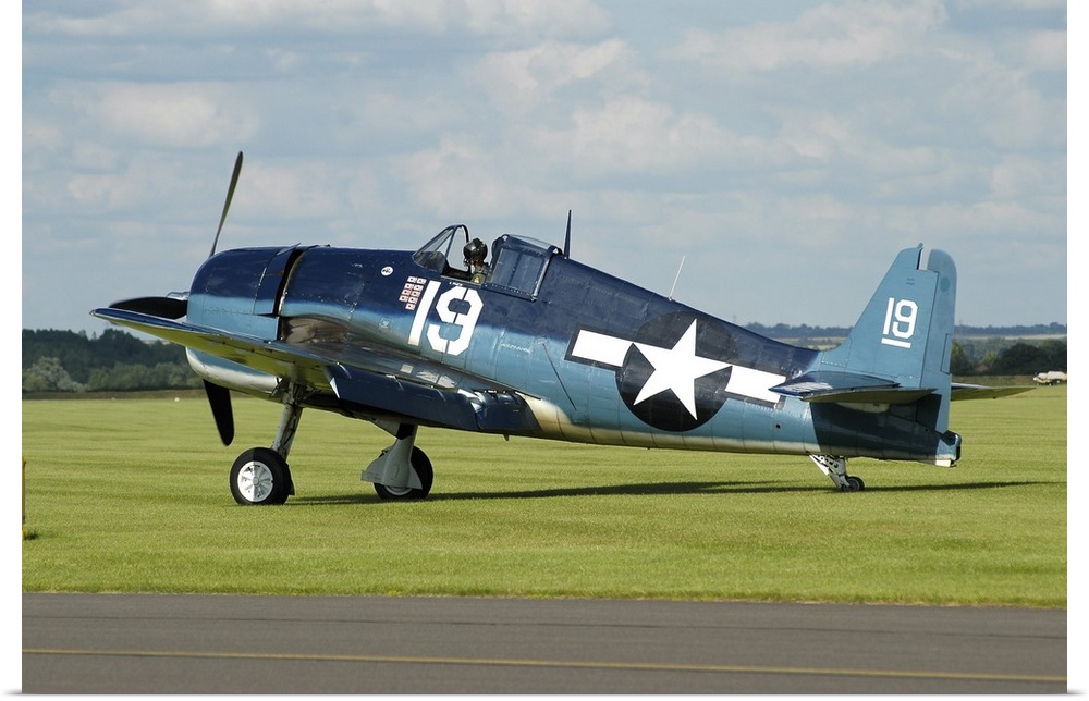 Grumman F6F Hellcat in World War II U.S. Navy colors while taxiing at Duxford airport, England.