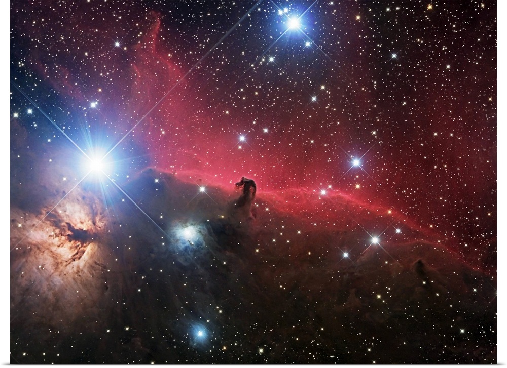 Space photograph of glowing clouds of nebulae in the Orion constellation system with a multitude of shining stars.