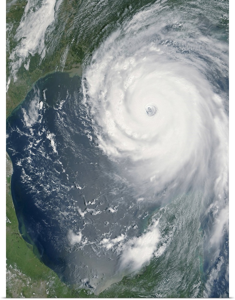 Big, vertical, aerial photograph of Hurricane Katrina swirling as she approaches land.