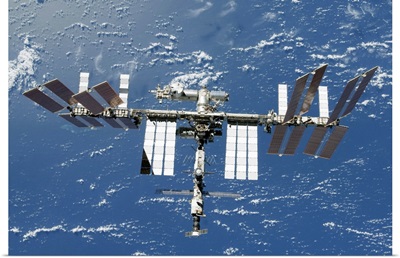International Space Station backdropped by a blue and white part of Earth